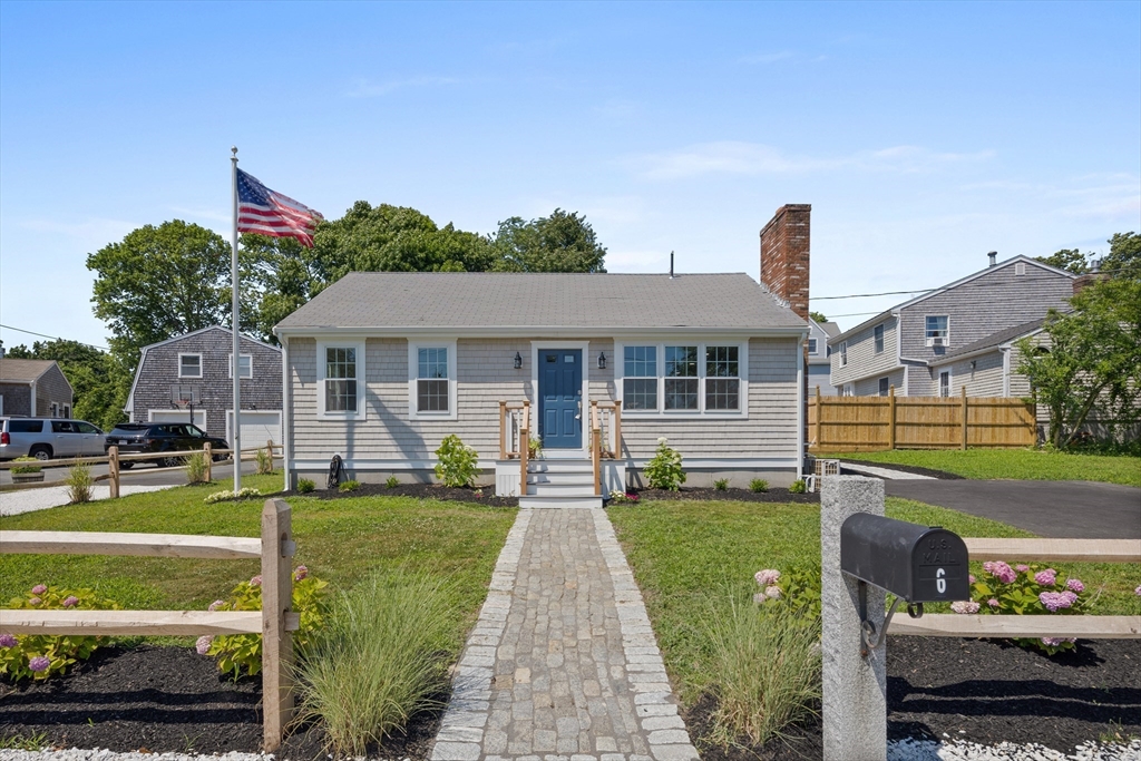6 Stenbeck Place Scituate, MA 02066 - Photo 24 of 24 a front view of a house with a yard table and chairs