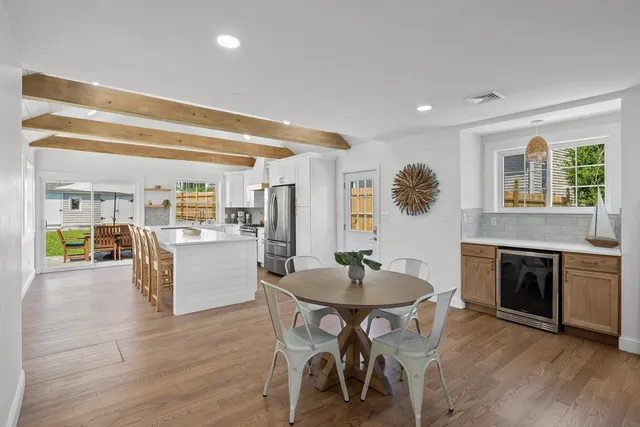 a kitchen with a table and chairs in it