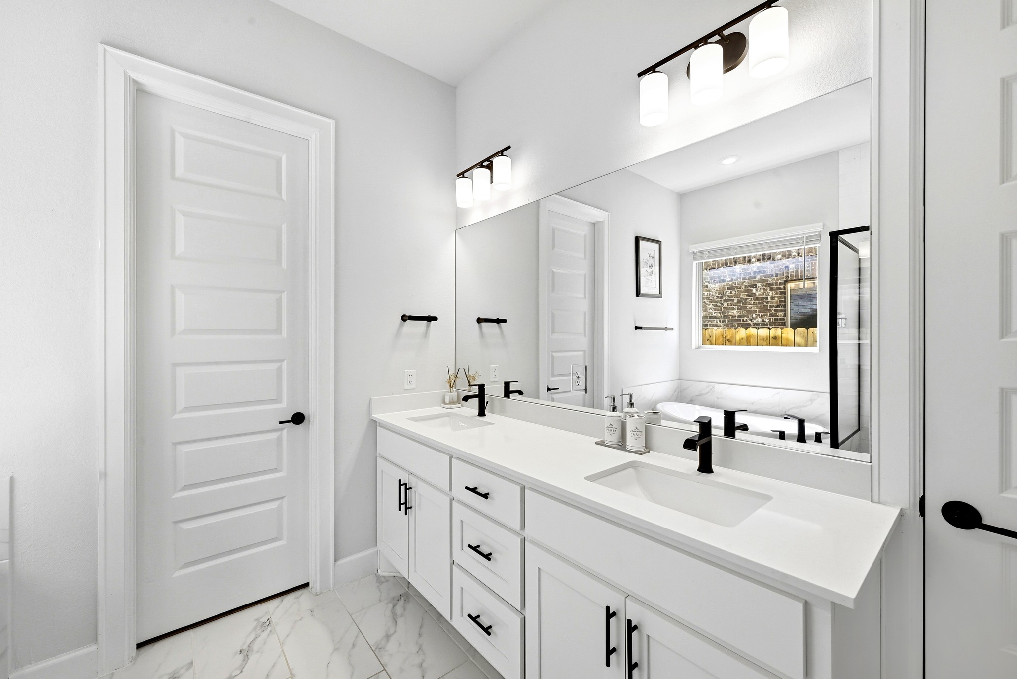 2702 Sebring Circle Austin, TX 78747 - Photo 14 of 35 Clean lines and a spacious double vanity define this modern master bath.