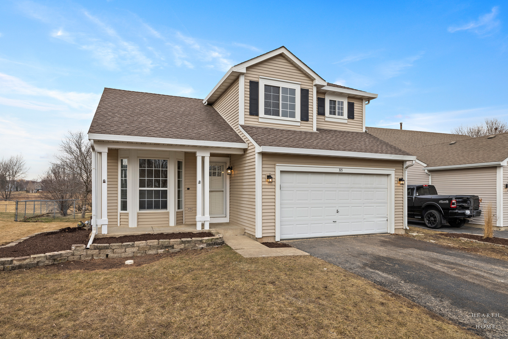 305 Harvest Gate Road Lake In The Hills, IL 60156 - Photo 1 of 36 a front view of a house with a yard and garage