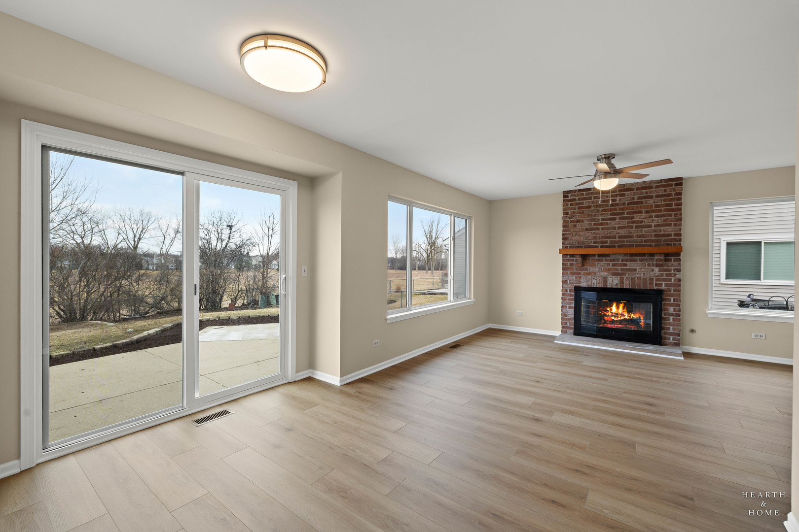305 Harvest Gate Road Lake In The Hills, IL 60156 - Photo 11 of 36 a view of an empty room with wooden floor and a window