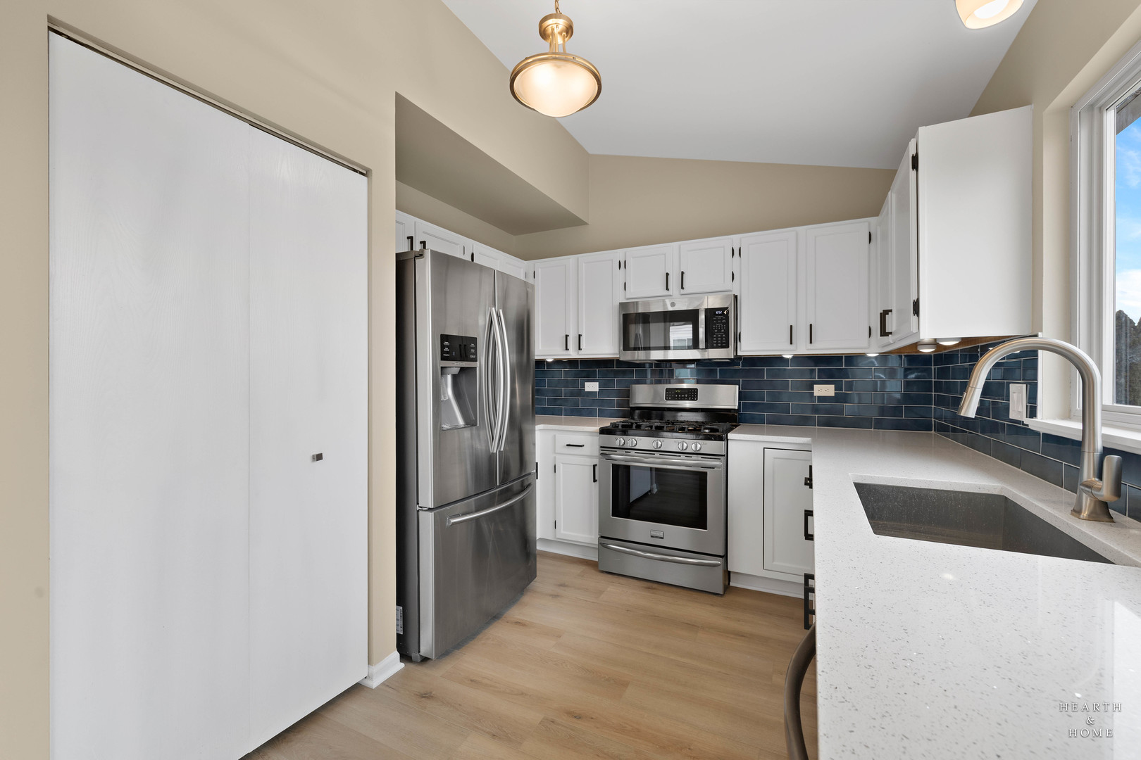 305 Harvest Gate Road Lake In The Hills, IL 60156 - Photo 12 of 36 a kitchen with stainless steel appliances granite countertop a refrigerator a stove a sink and a microwave