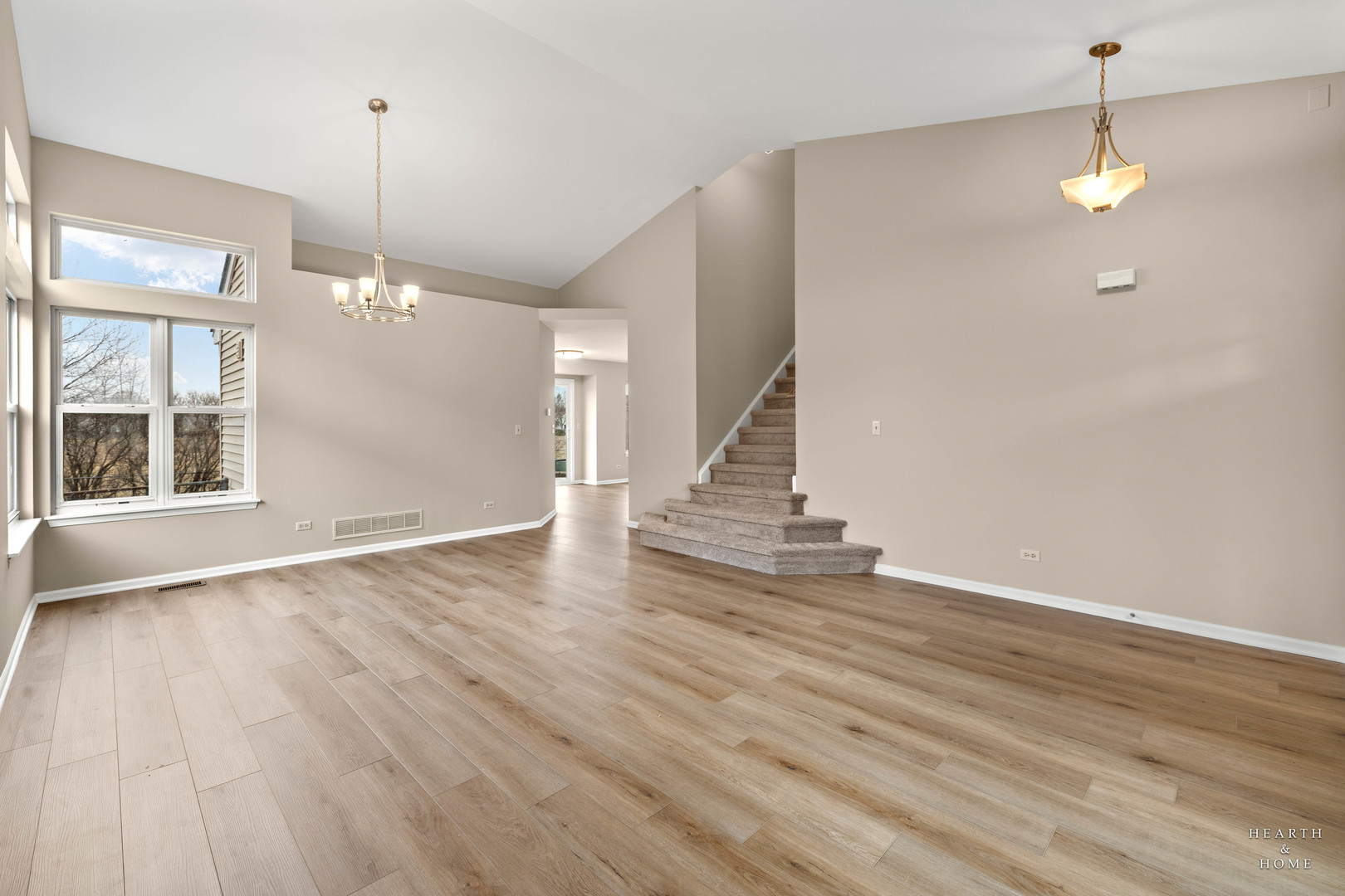 305 Harvest Gate Road Lake In The Hills, IL 60156 - Photo 14 of 36 a view of an empty room with wooden floor and a window