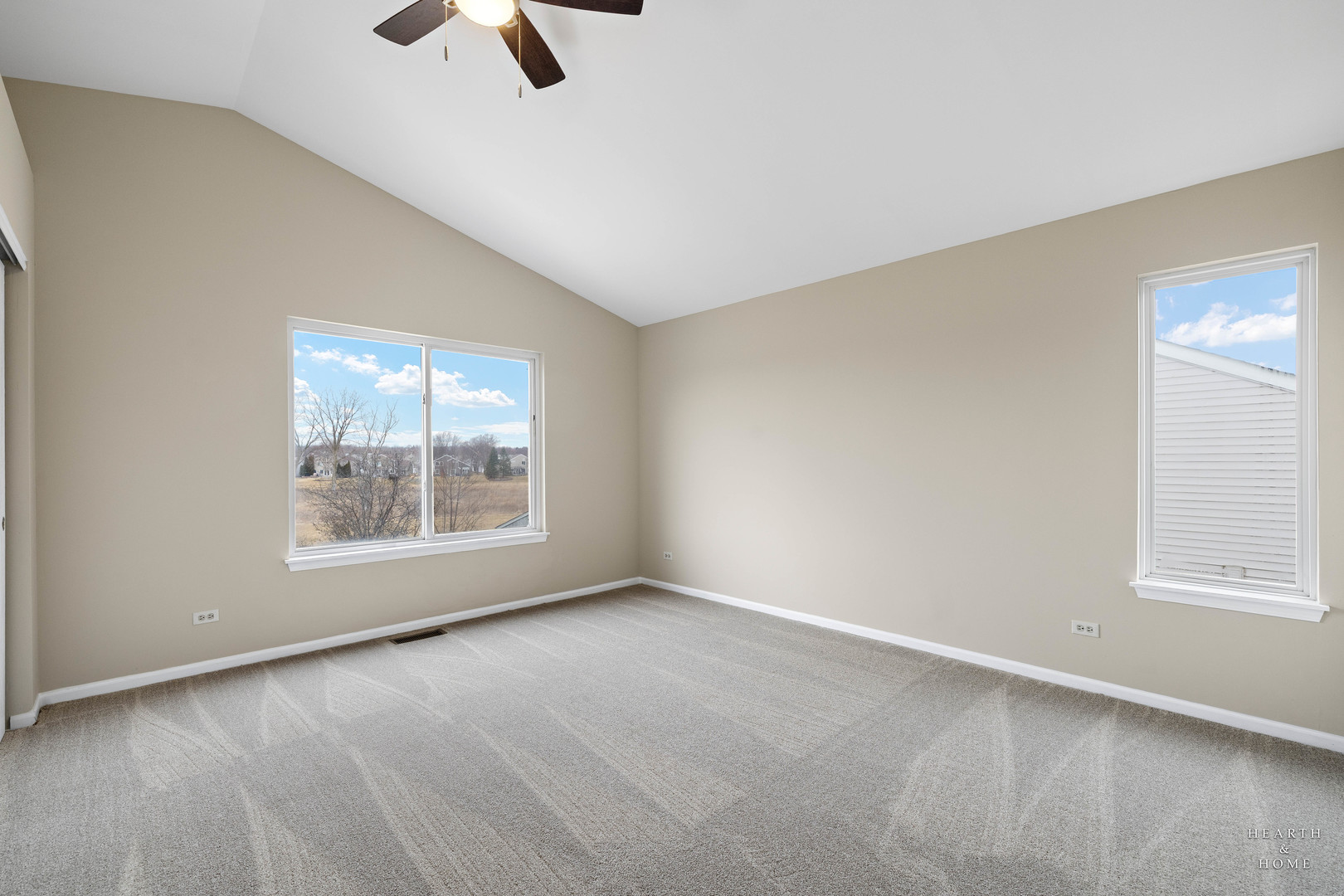 305 Harvest Gate Road Lake In The Hills, IL 60156 - Photo 16 of 36 an empty room with chandelier fan and windows