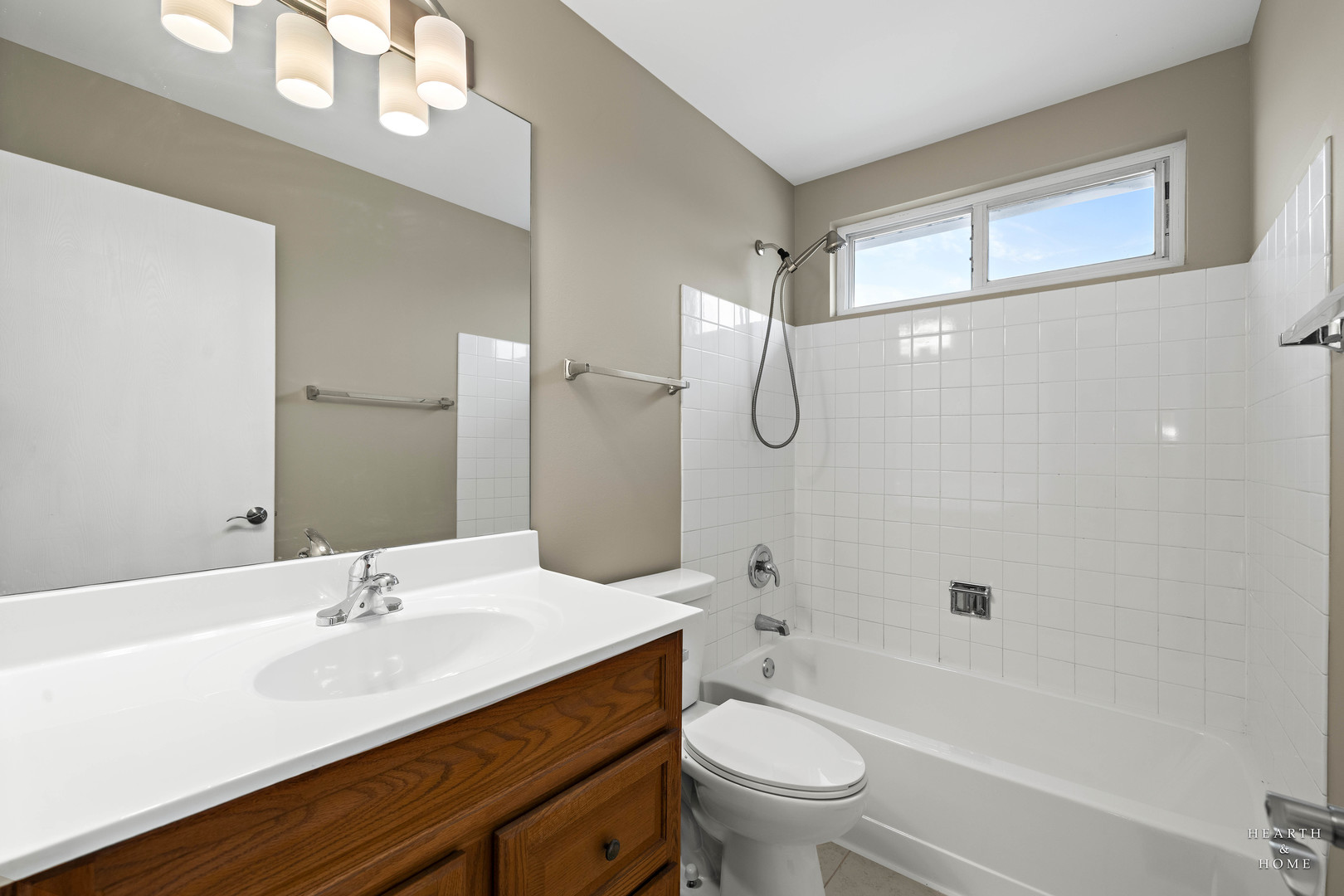 305 Harvest Gate Road Lake In The Hills, IL 60156 - Photo 21 of 36 a bathroom with a granite countertop sink a toilet a mirror a bathtub and shower