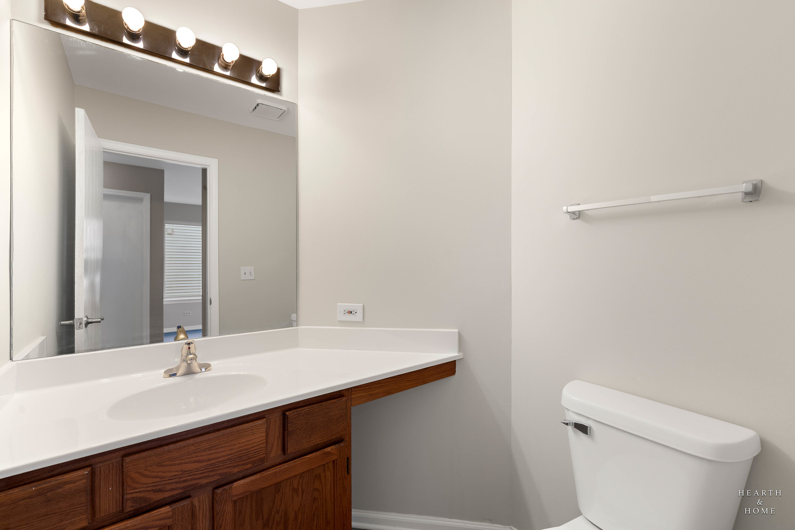 305 Harvest Gate Road Lake In The Hills, IL 60156 - Photo 22 of 36 a bathroom with a sink a toilet and a mirror