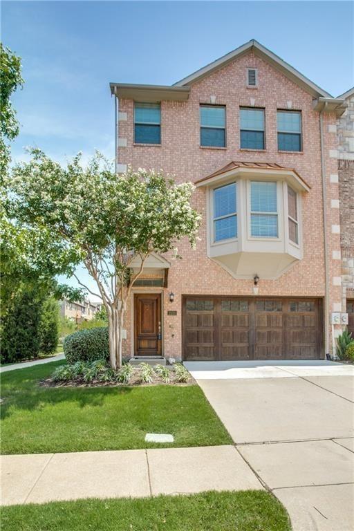 1531 Biltmore Lane Irving, TX 75063 - Photo 1 of 1 View of front facade featuring driveway, brick siding, a front lawn, and an attached garage
