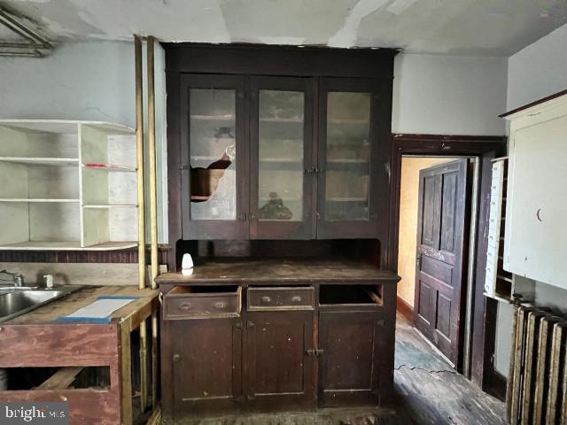 127 West Main Street Westminster, MD 21157 - Photo 18 of 25 a kitchen with a sink and a refrigerator