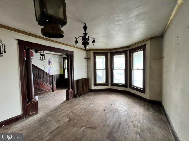 127 West Main Street Westminster, MD 21157 - Photo 23 of 25 wooden floor in an empty room with a window