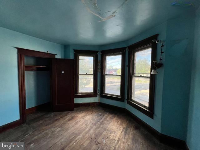 127 West Main Street Westminster, MD 21157 - Photo 6 of 25 an empty room with wooden floor and windows