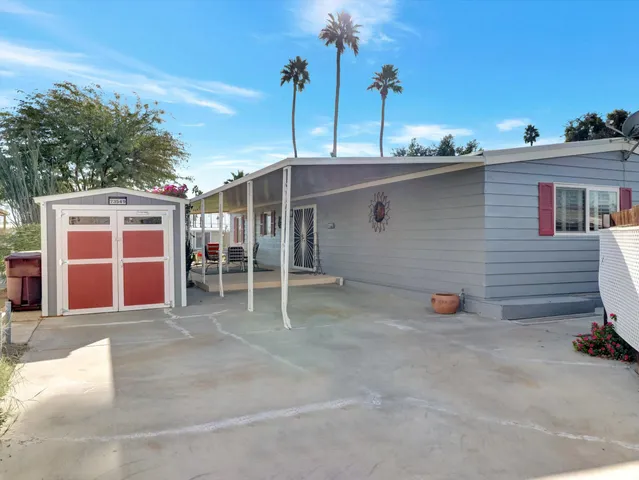 a view of front door and potted plants