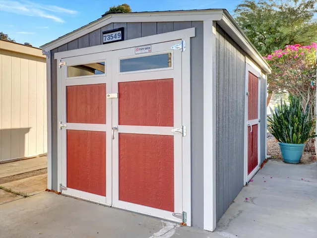 a view of a bathroom with sink and shower