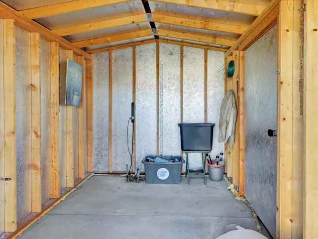 a view of walk in closet with wooden floor