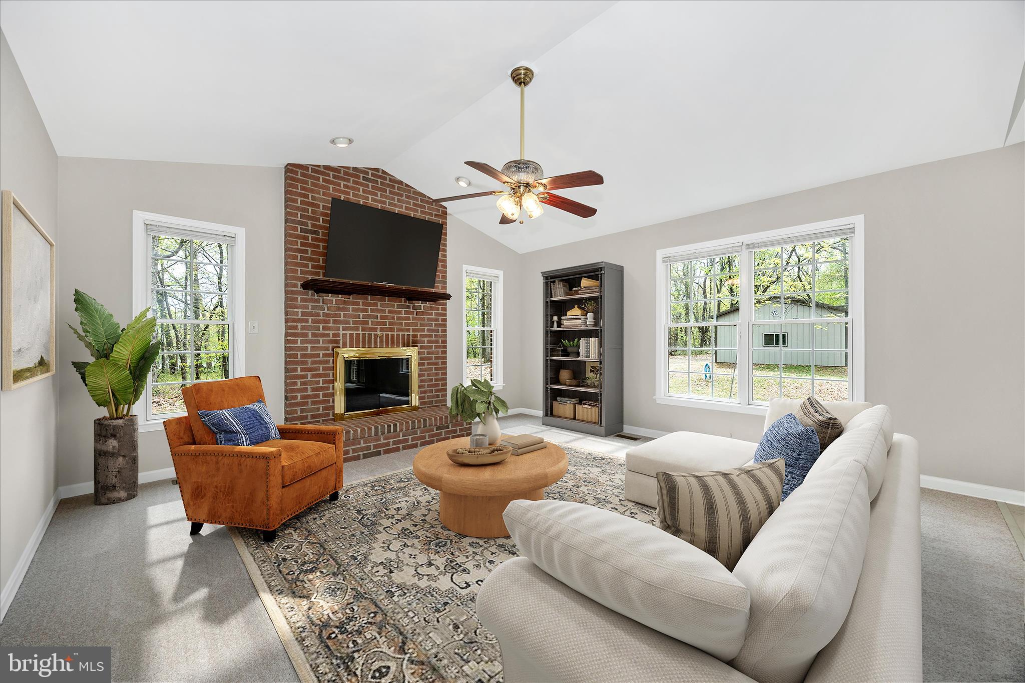 10393 Liberty Road Frederick, MD 21701 - Photo 3 of 47 a living room with furniture a flat screen tv and a fireplace