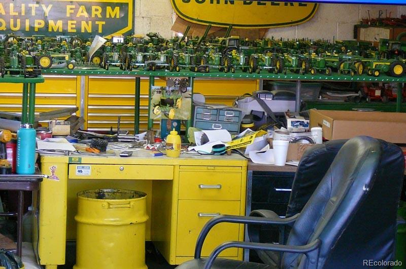 2024 Strasburg Road Strasburg, CO 80136 - Photo 16 of 18 a view of a swimming pool with a lounge chairs