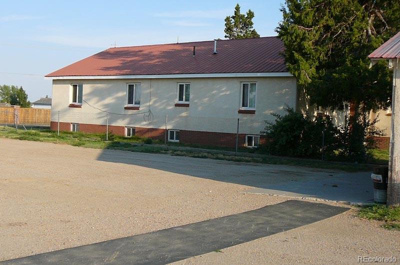 2024 Strasburg Road Strasburg, CO 80136 - Photo 9 of 18 front view of a house and a yard