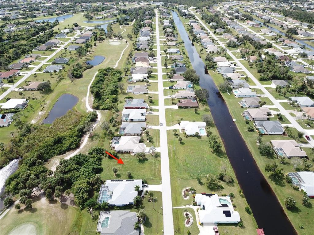 54 Marker Road Rotonda West, FL 33947 - Photo 2 of 5 an aerial view of residential houses with outdoor space