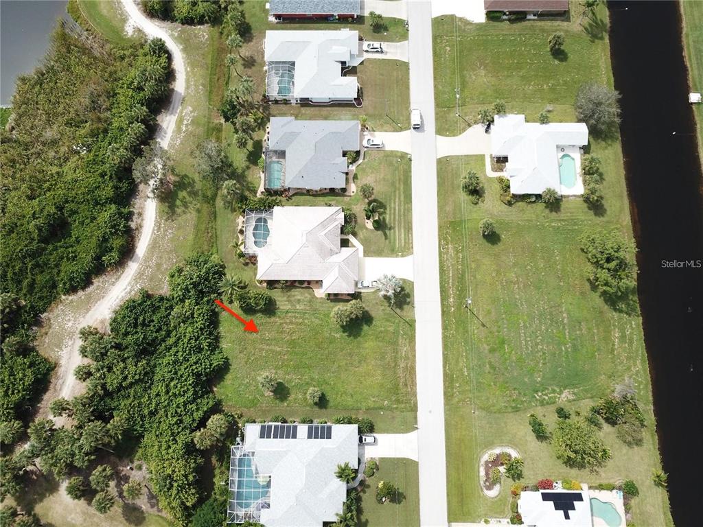 54 Marker Road Rotonda West, FL 33947 - Photo 3 of 5 an aerial view of a residential houses with outdoor space