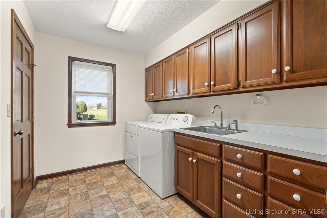 470 South Heidelberg Road Southwest Corydon, IN 47112 - Photo 16 of 92 Laundry Room w/ sink, counter, cabinets and 2 closets for storage. Washer and Dryer remain.