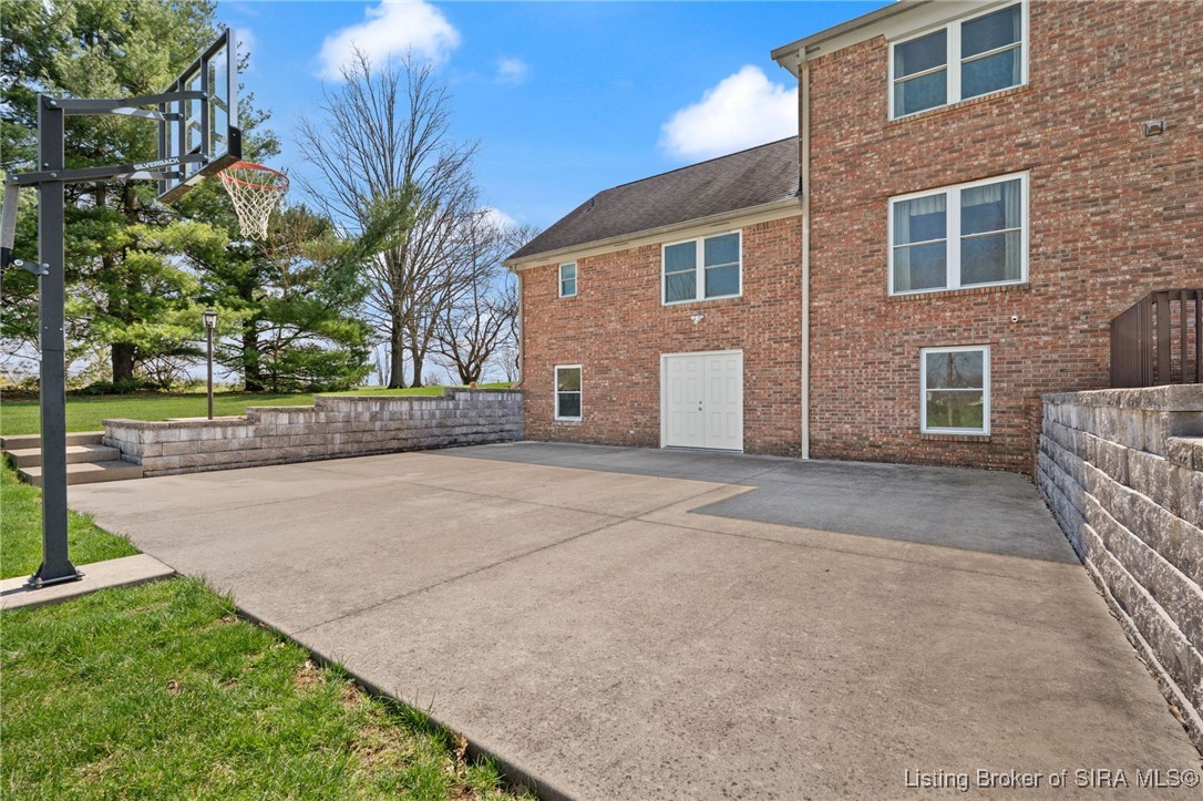 470 South Heidelberg Road Southwest Corydon, IN 47112 - Photo 22 of 92 Large concrete patio off walk out basement area. Basketball goal stays.