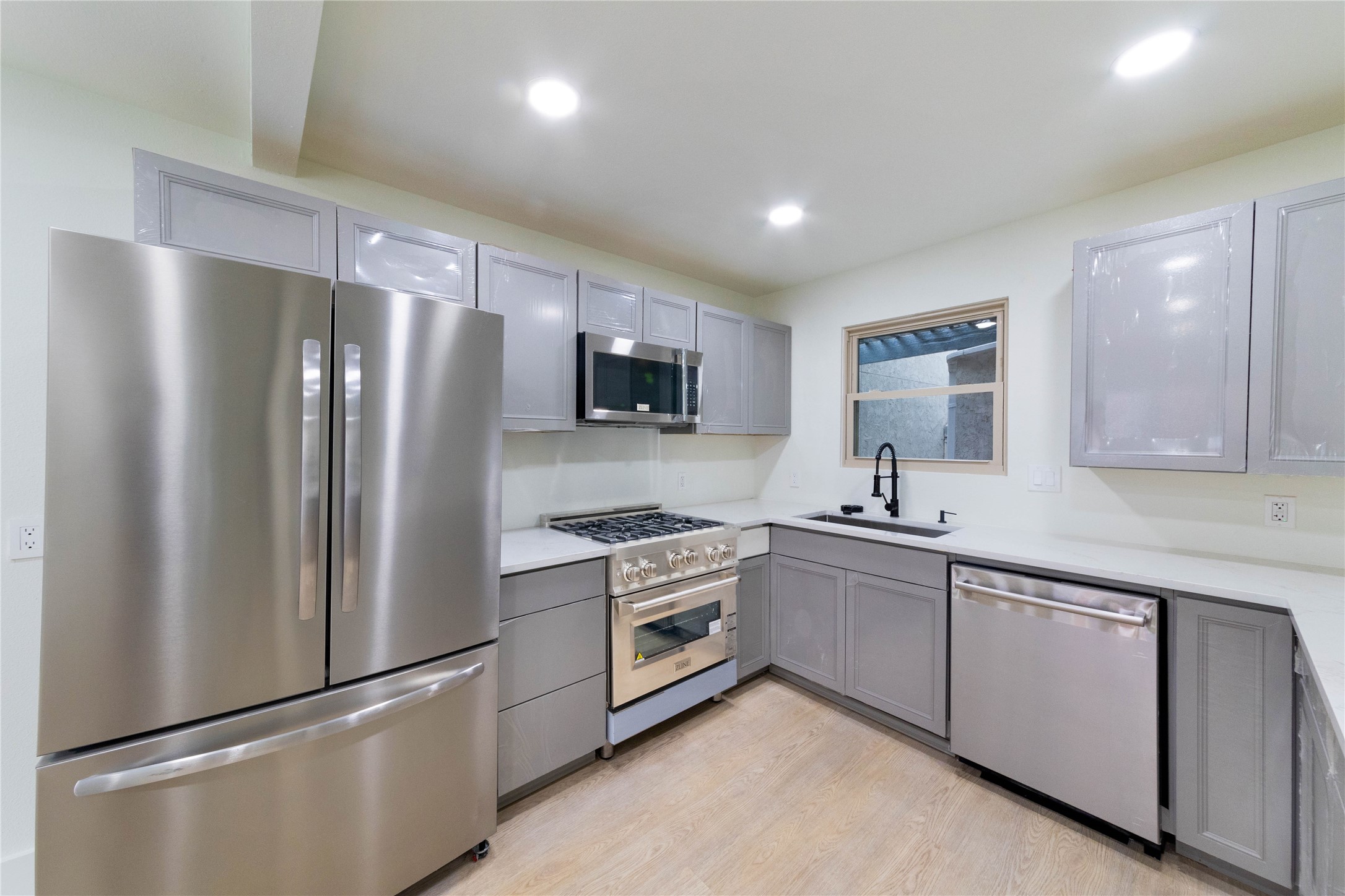 8807 Merion Circle Austin, TX 78754 - Photo 8 of 18 Culinary creations come to life in this kitchen, featuring sleek stainless steel appliances.