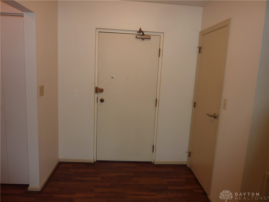 1345 Tattersall Road, Unit 64 Dayton, OH 45459 - Photo 3 of 25 This inviting entryway features rich wood flooring, offering a warm welcome into the residence.