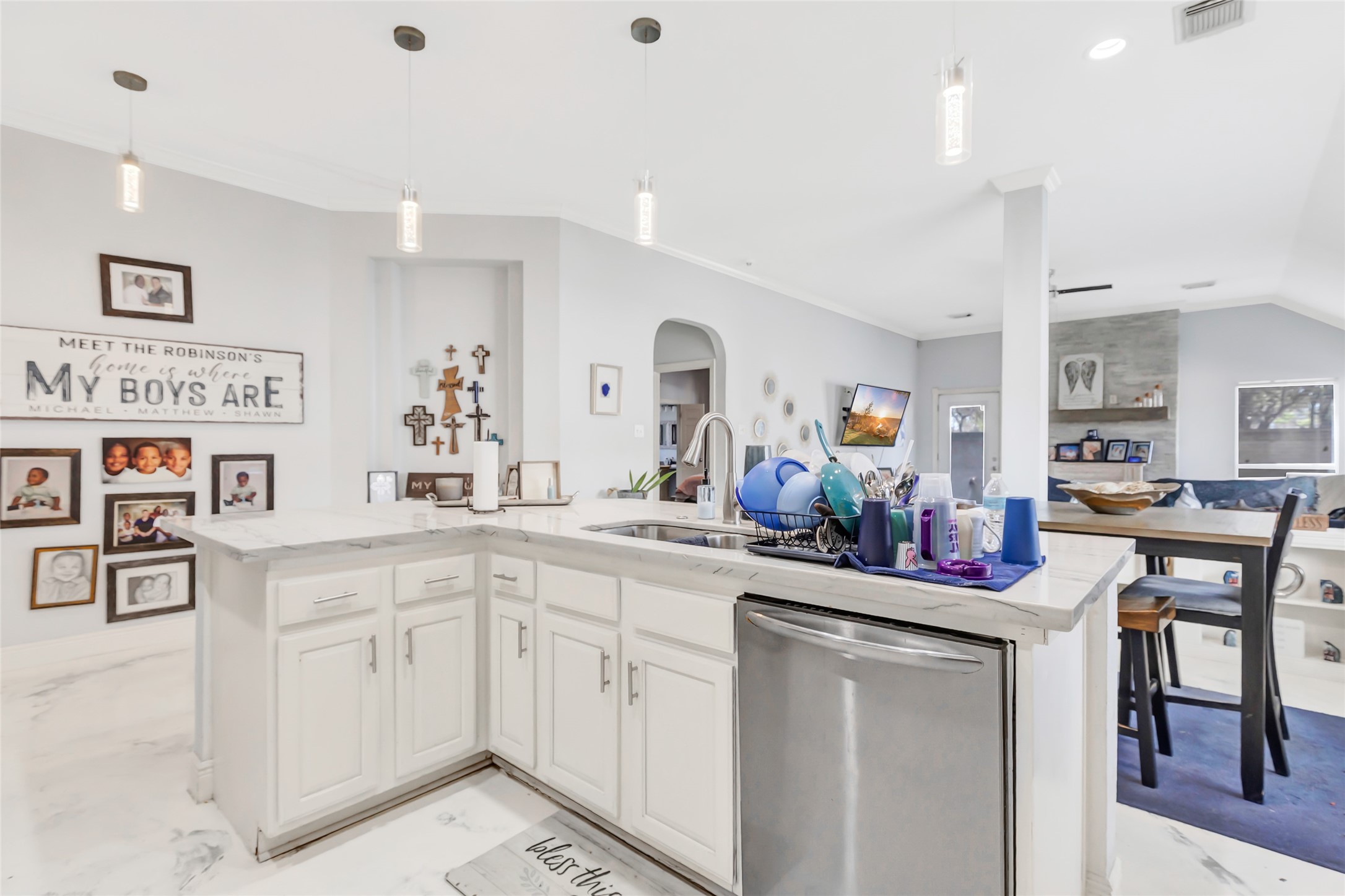 14415 Red Mulberry Lane Houston, TX 77044 - Photo 11 of 26 a kitchen with cabinets and chairs in it