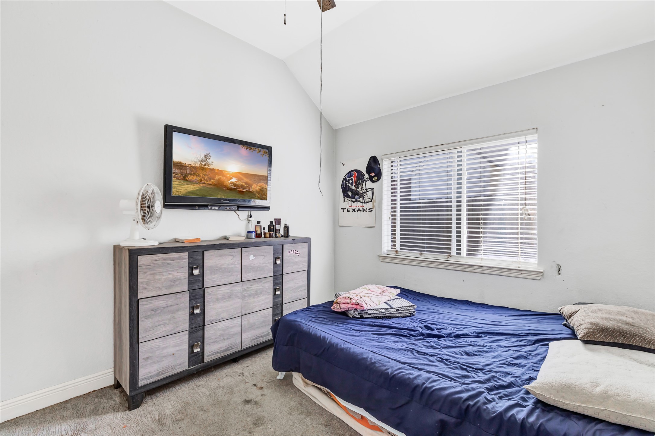 14415 Red Mulberry Lane Houston, TX 77044 - Photo 22 of 26 a bedroom with a bed and a flat screen tv