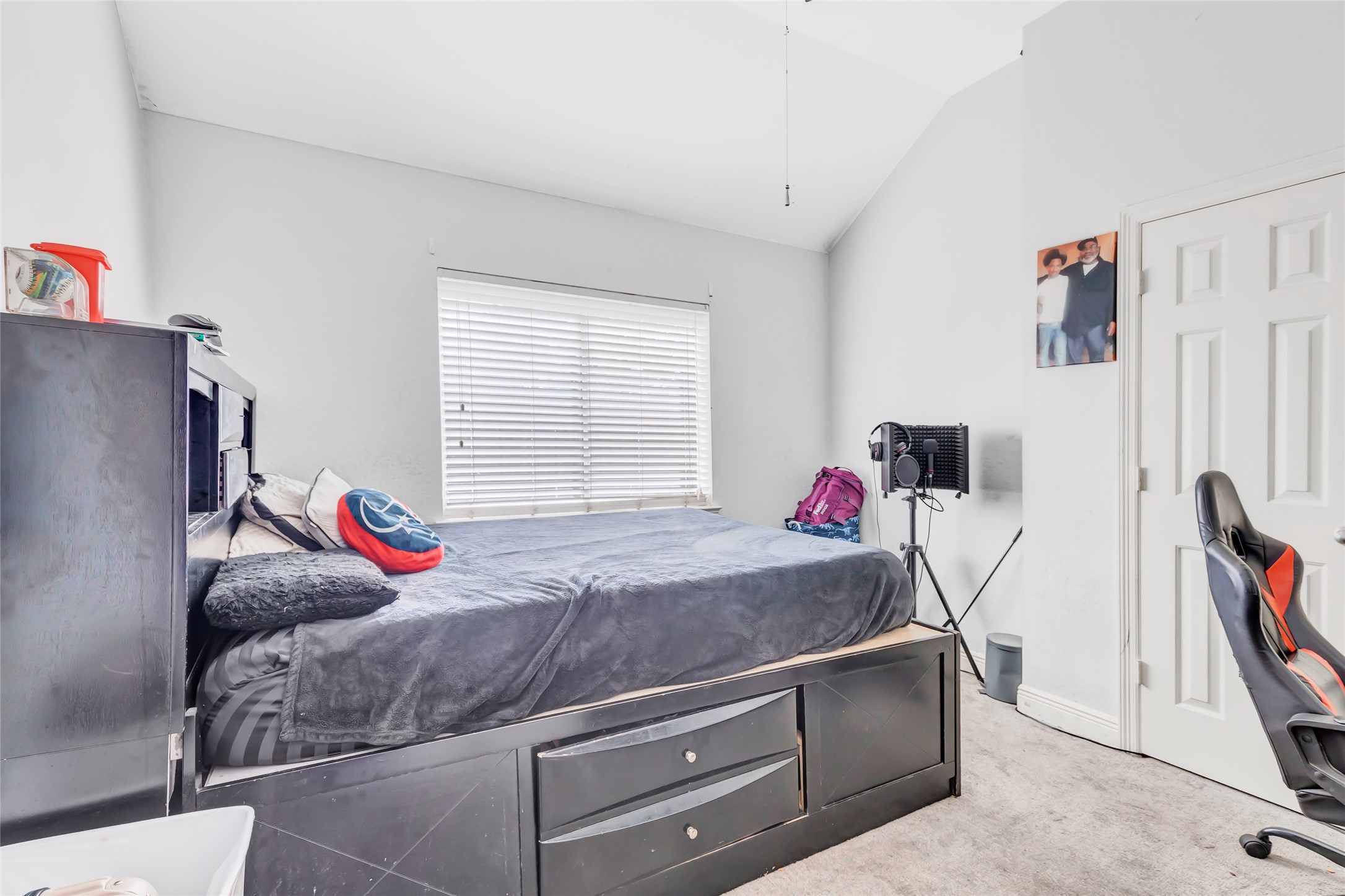 14415 Red Mulberry Lane Houston, TX 77044 - Photo 23 of 26 a living room with furniture and a flat screen tv