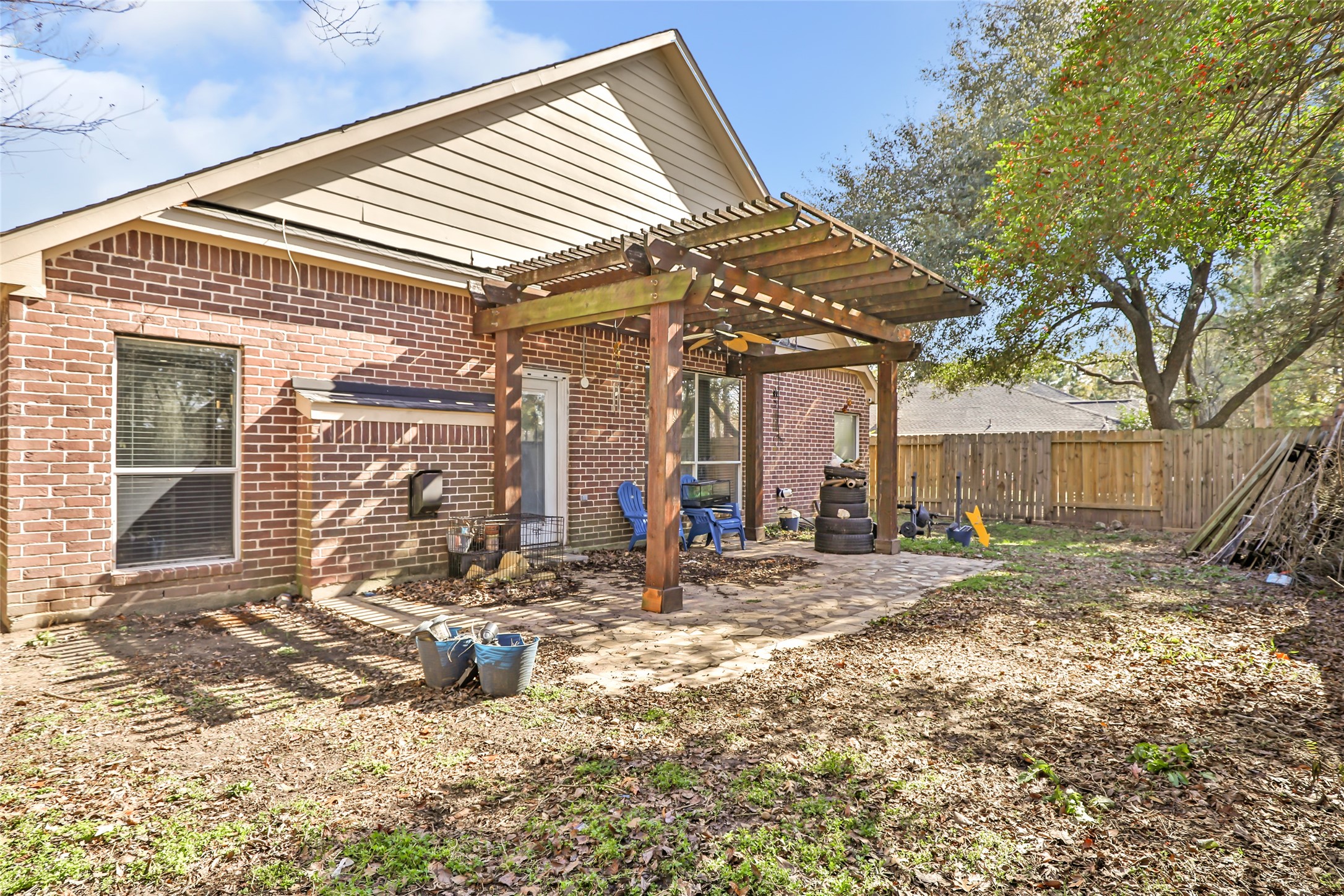 14415 Red Mulberry Lane Houston, TX 77044 - Photo 25 of 26 a view of a house with backyard