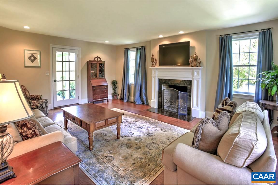 5975 Free Union Road Free Union, VA 22940 - Photo 5 of 25 The bright light filled living room includes a wood burning fireplace.