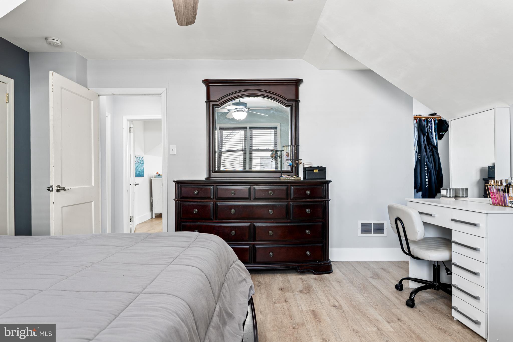 308 Providence Road Morton, PA 19070 - Photo 12 of 30 a bedroom with a bed and a mirror on dresser