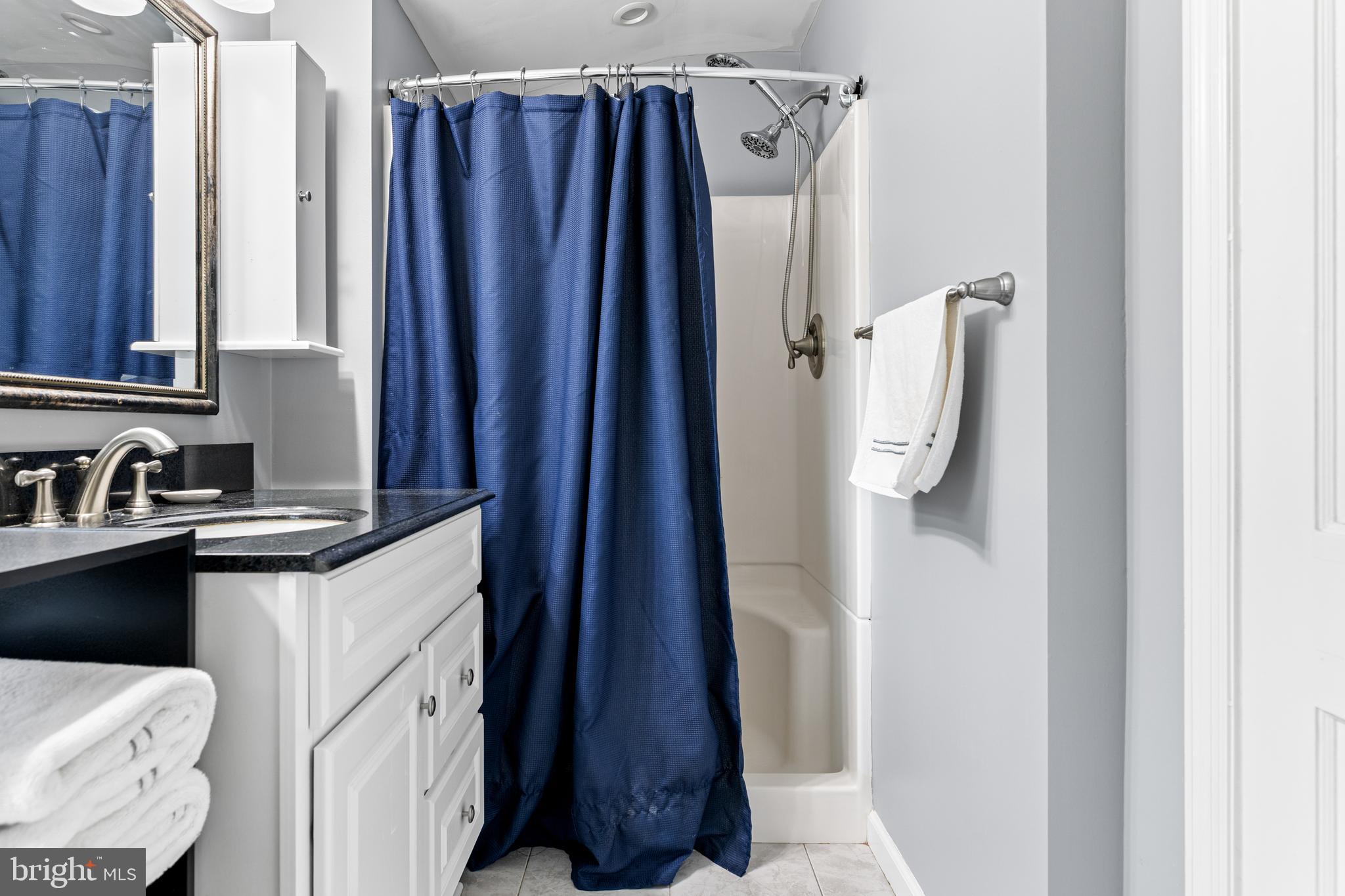 308 Providence Road Morton, PA 19070 - Photo 21 of 30 a bathroom with a sink and mirror
