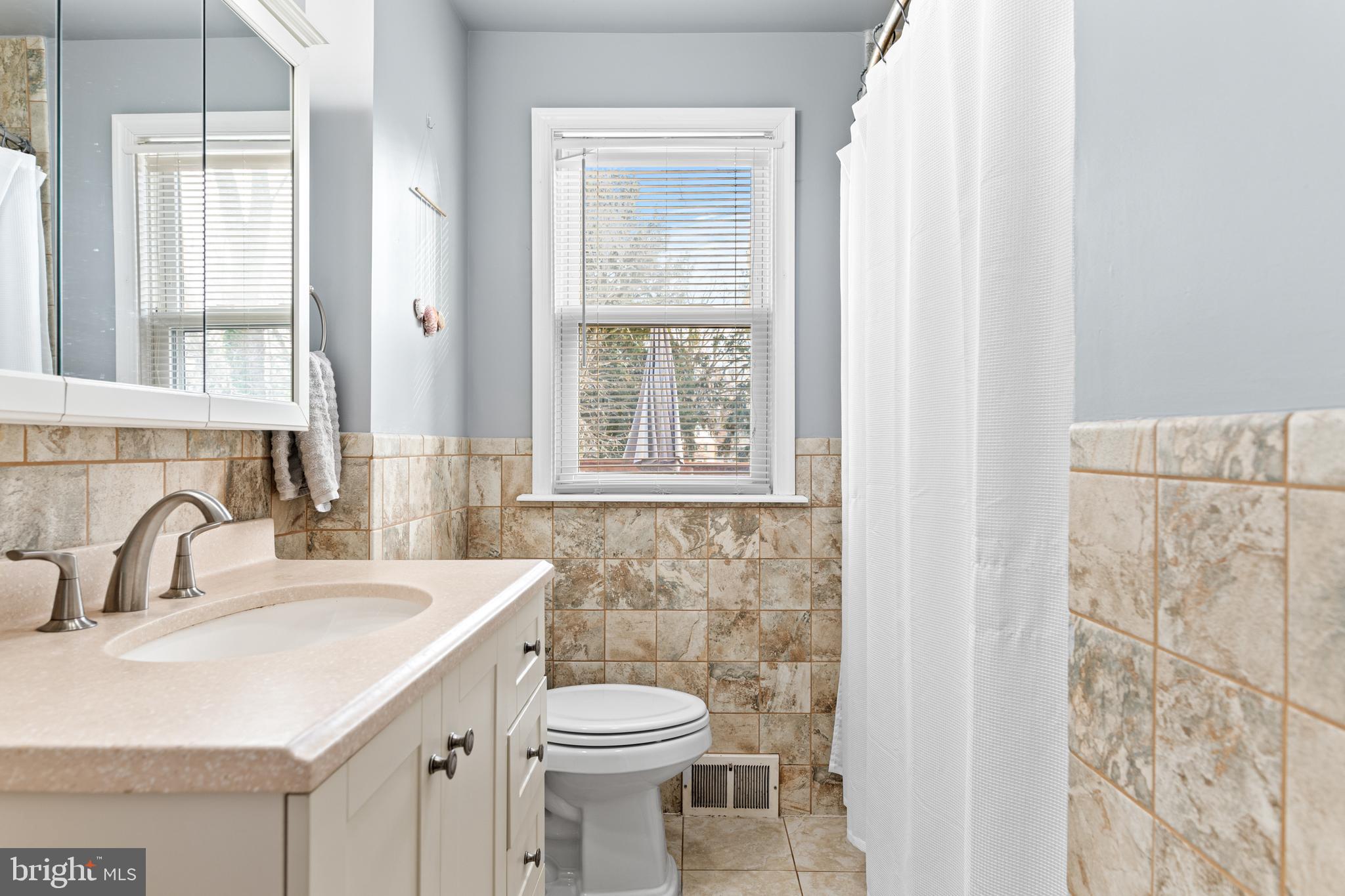 308 Providence Road Morton, PA 19070 - Photo 23 of 30 a bathroom with a sink and a toilet