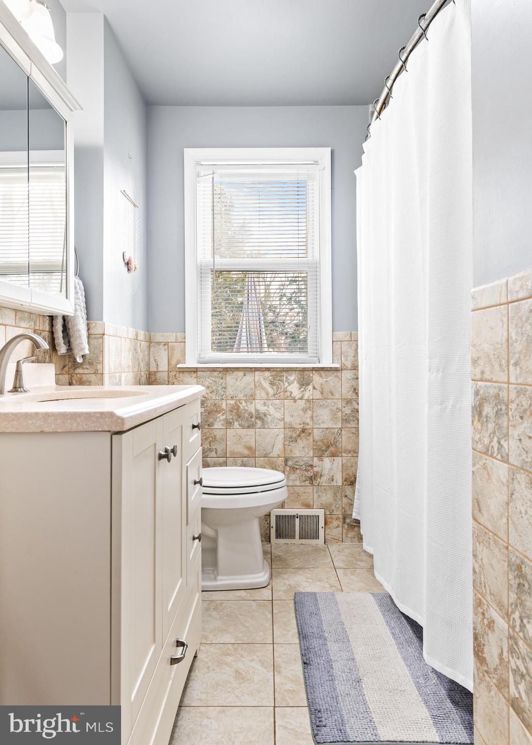 308 Providence Road Morton, PA 19070 - Photo 24 of 30 a bathroom with a sink toilet and mirror
