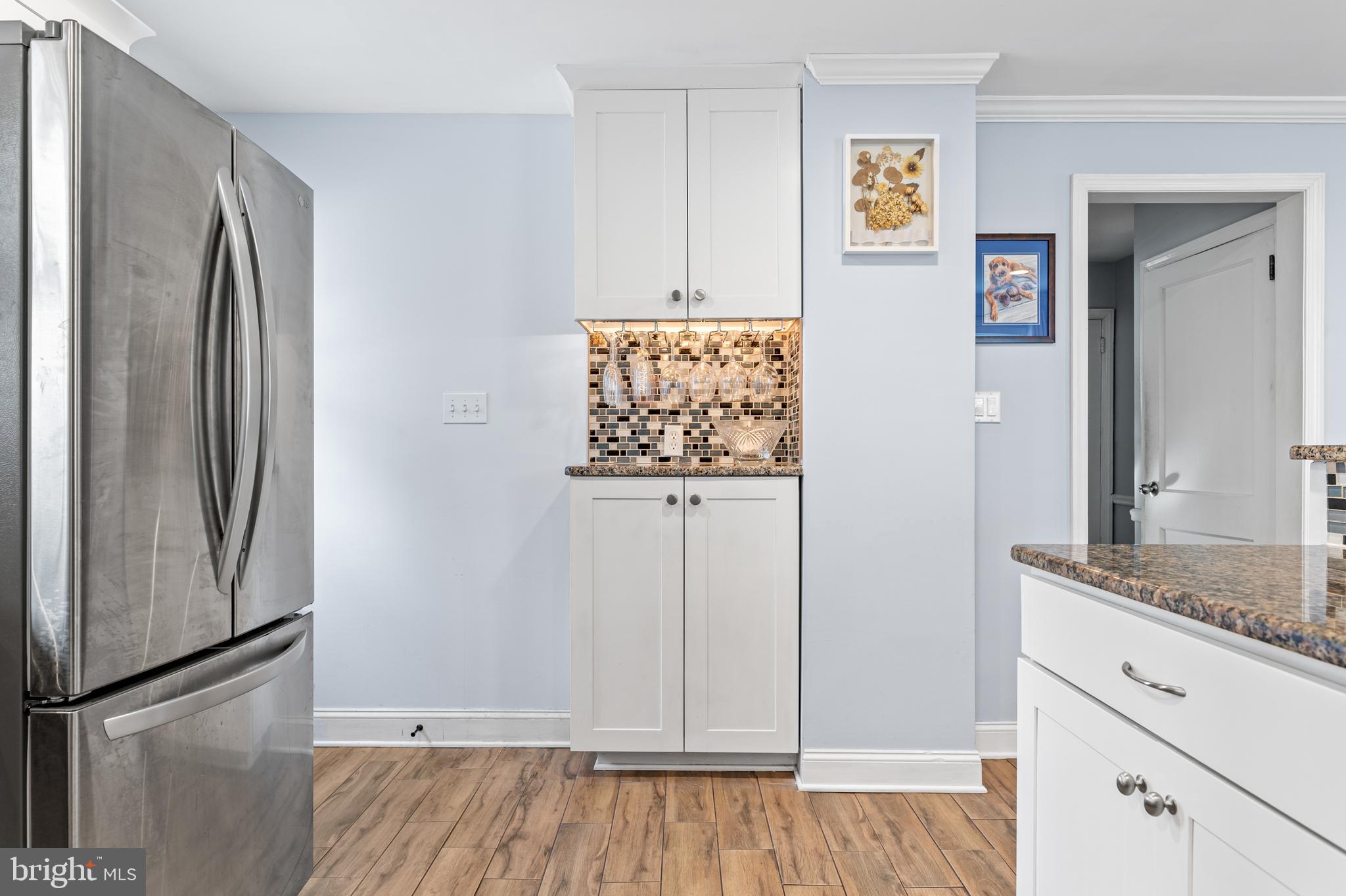 308 Providence Road Morton, PA 19070 - Photo 9 of 30 a view of kitchen with stainless steel appliances wooden floor and cabinets