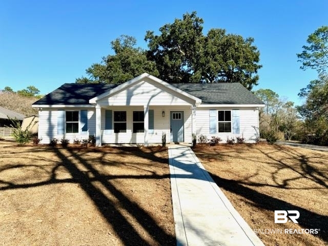 403 East 4th Street Bay Minette, AL 36507 - Photo 1 of 19 View of front of property with a front yard and covered porch