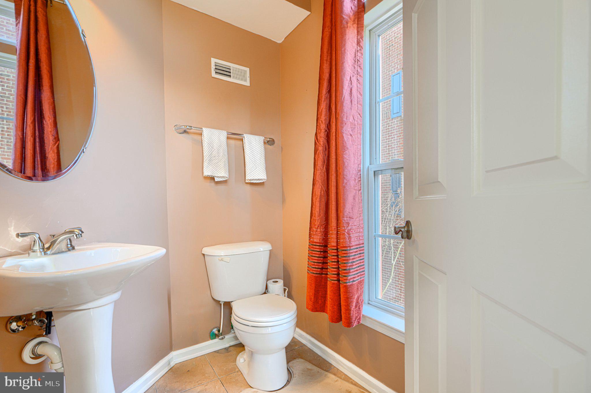 9307 Summit View Way Perry Hall, MD 21128 - Photo 14 of 26 a bathroom with a sink and a mirror