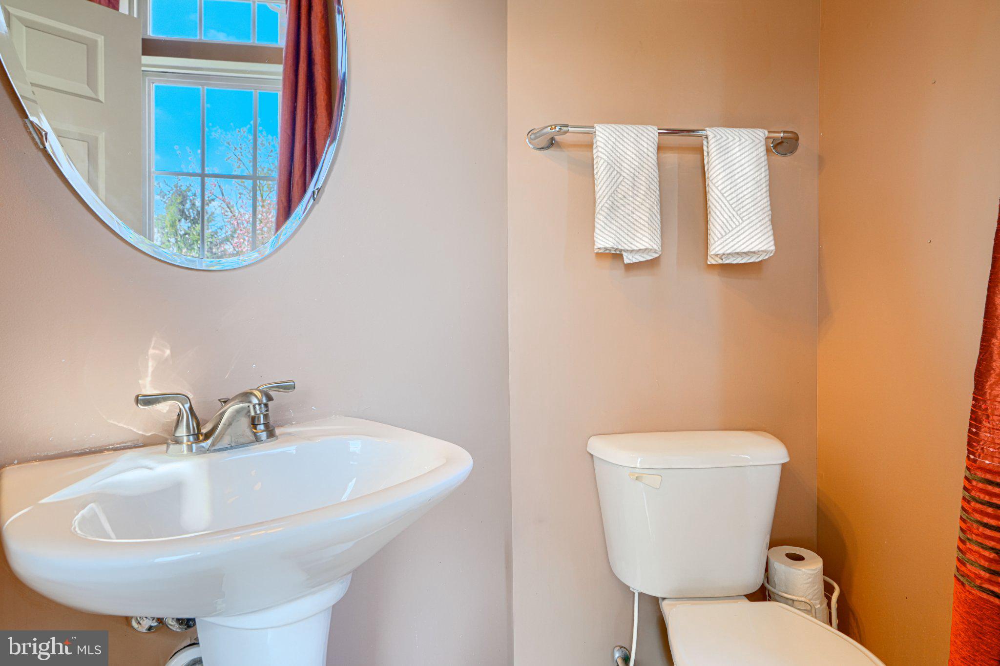 9307 Summit View Way Perry Hall, MD 21128 - Photo 15 of 26 a bathroom with a toilet sink and mirror
