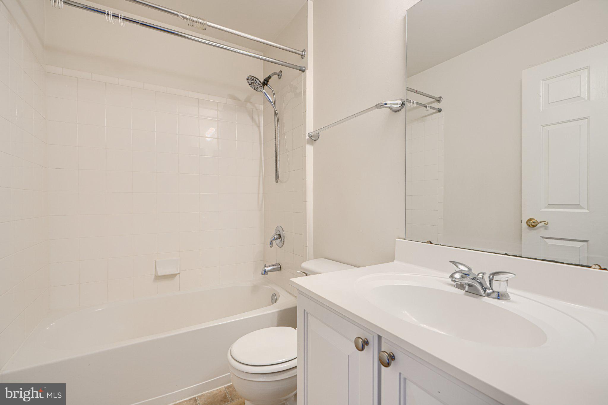 9307 Summit View Way Perry Hall, MD 21128 - Photo 19 of 26 a bathroom with a granite countertop sink toilet and shower