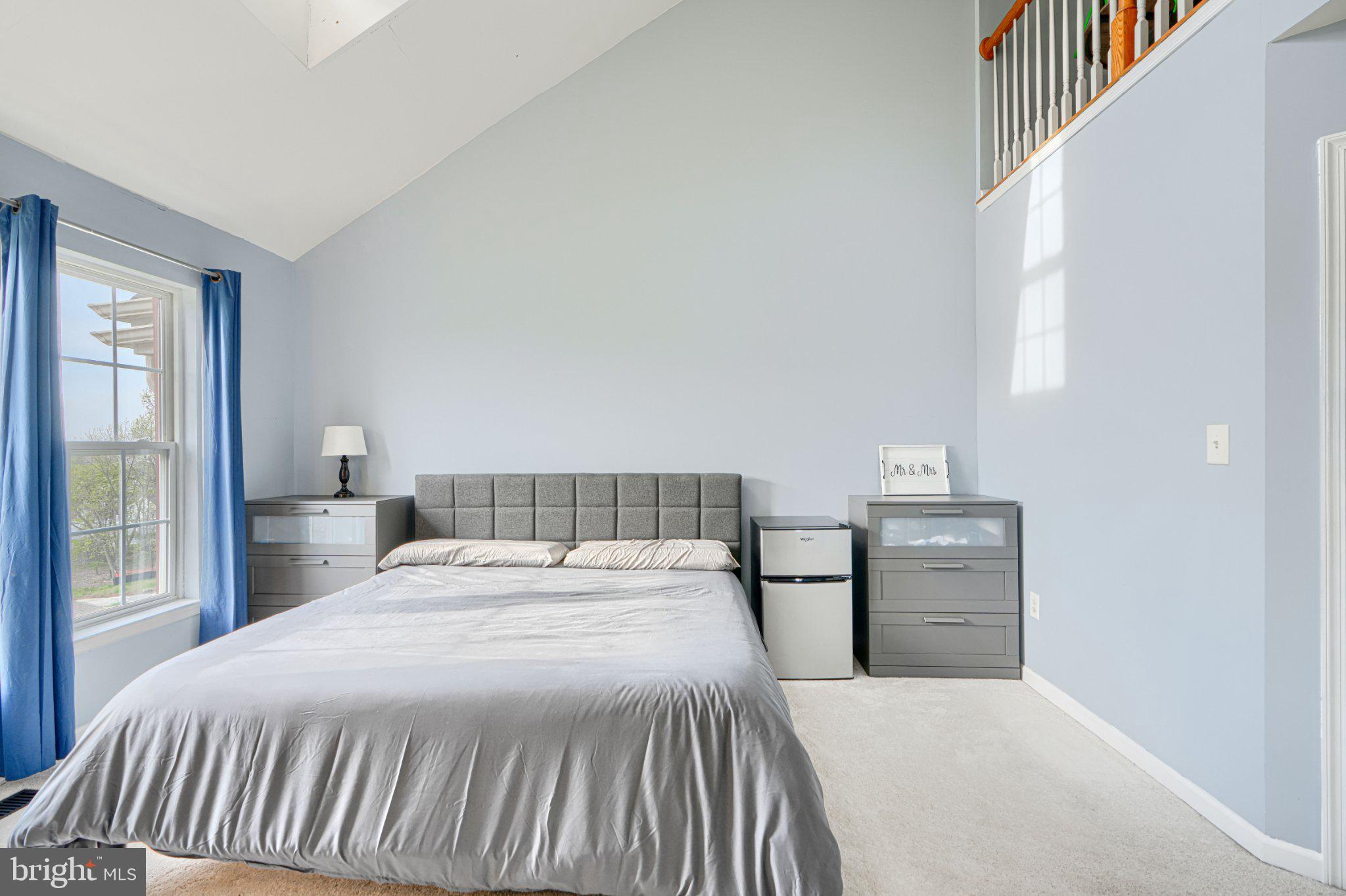 9307 Summit View Way Perry Hall, MD 21128 - Photo 20 of 26 a bedroom with a bed and wooden floor