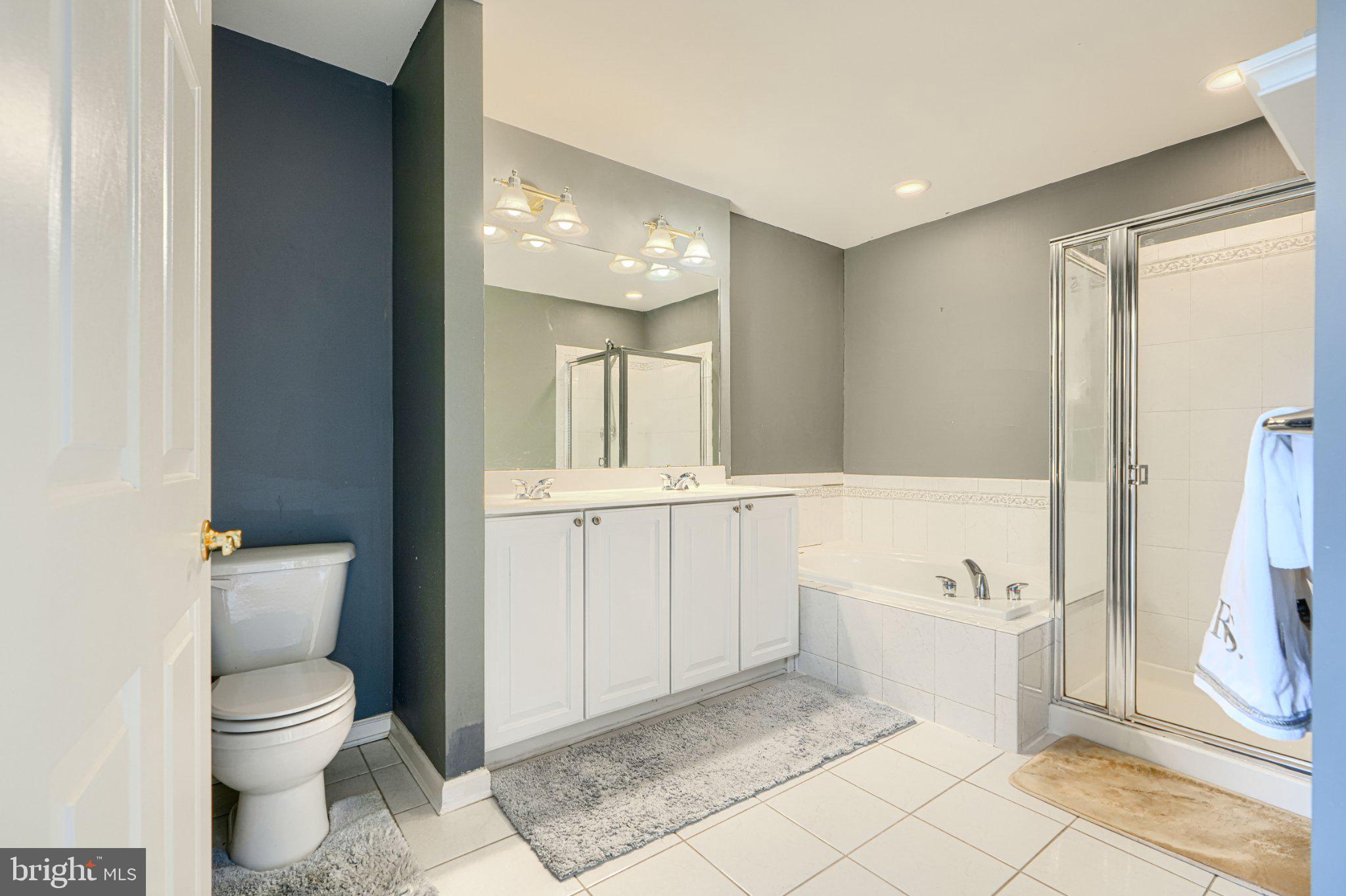9307 Summit View Way Perry Hall, MD 21128 - Photo 24 of 26 a bathroom with a toilet a sink and bathtub