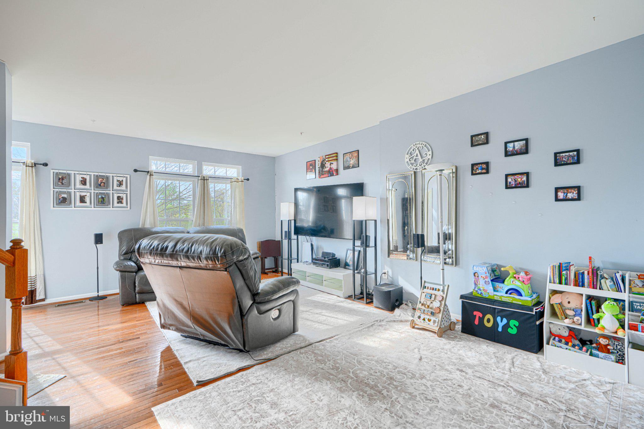 9307 Summit View Way Perry Hall, MD 21128 - Photo 8 of 26 a living room with furniture and a baby crib
