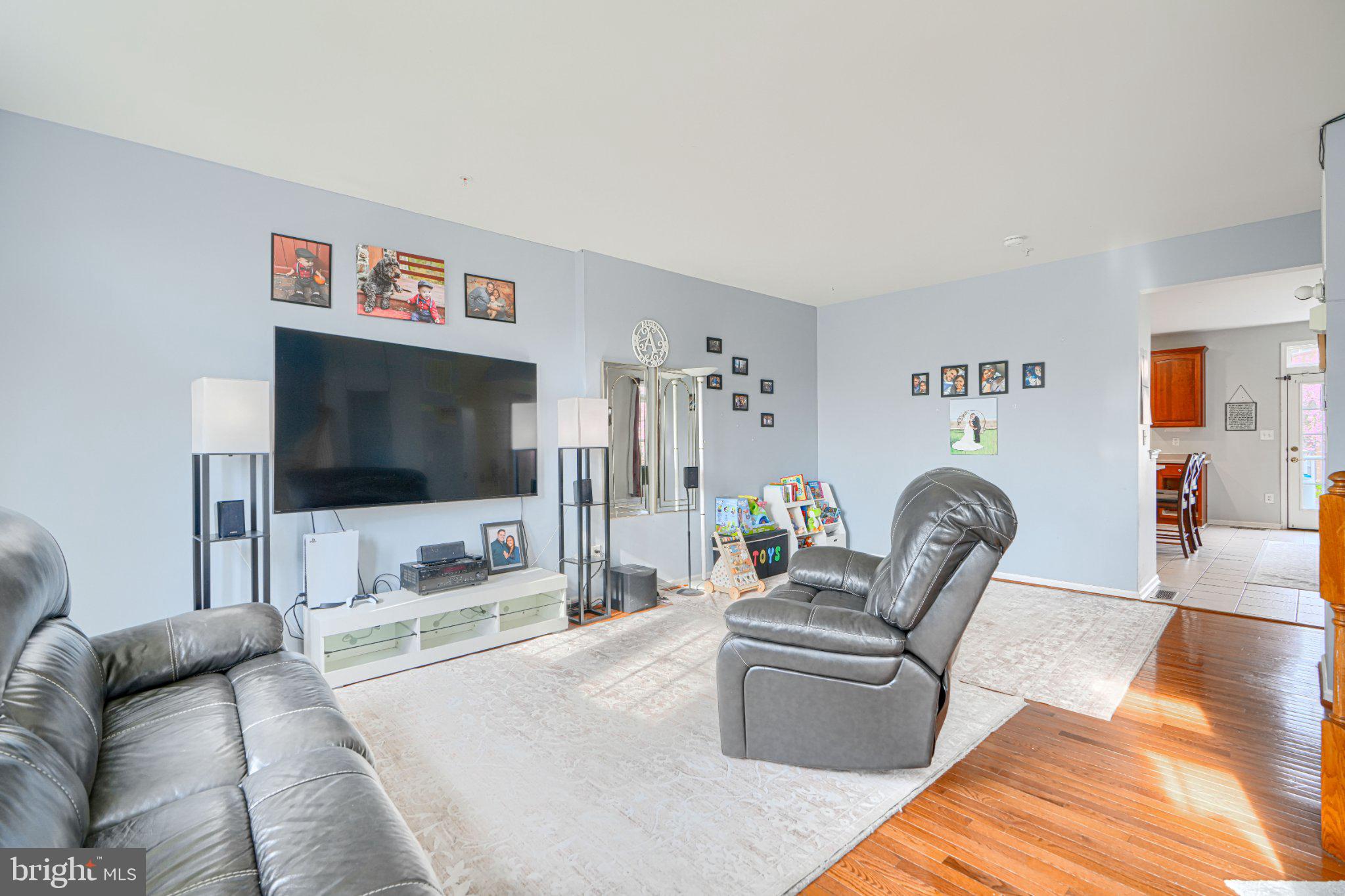 9307 Summit View Way Perry Hall, MD 21128 - Photo 9 of 26 a living room with furniture and a flat screen tv