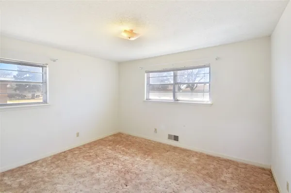 an empty room with a natural light