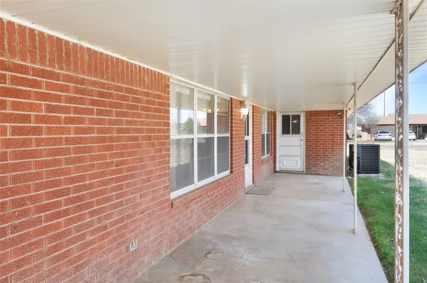 a view of a porch with seating space