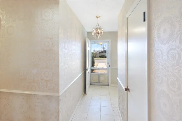 a bathroom with a glass shower door and a sink