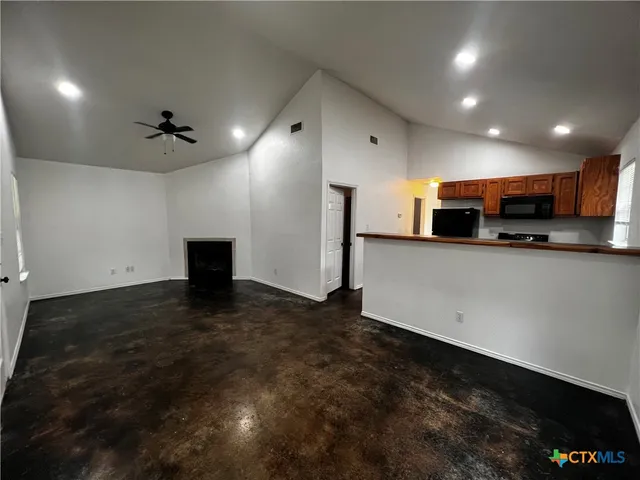 a kitchen with stainless steel appliances a refrigerator and a sink