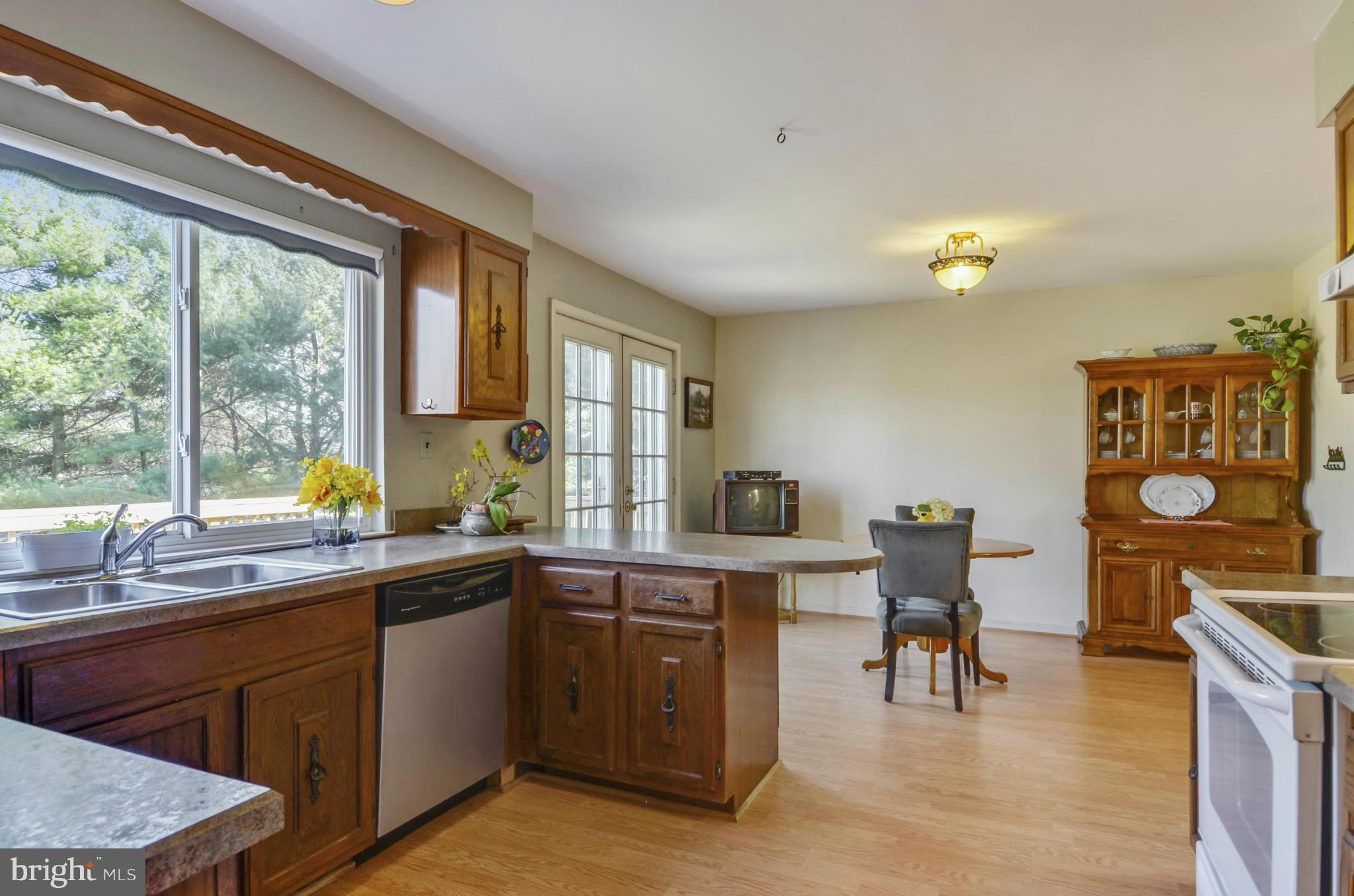 9833 Moyer Road Damascus, MD 20872 - Photo 8 of 26 a kitchen with a sink cabinets and appliances