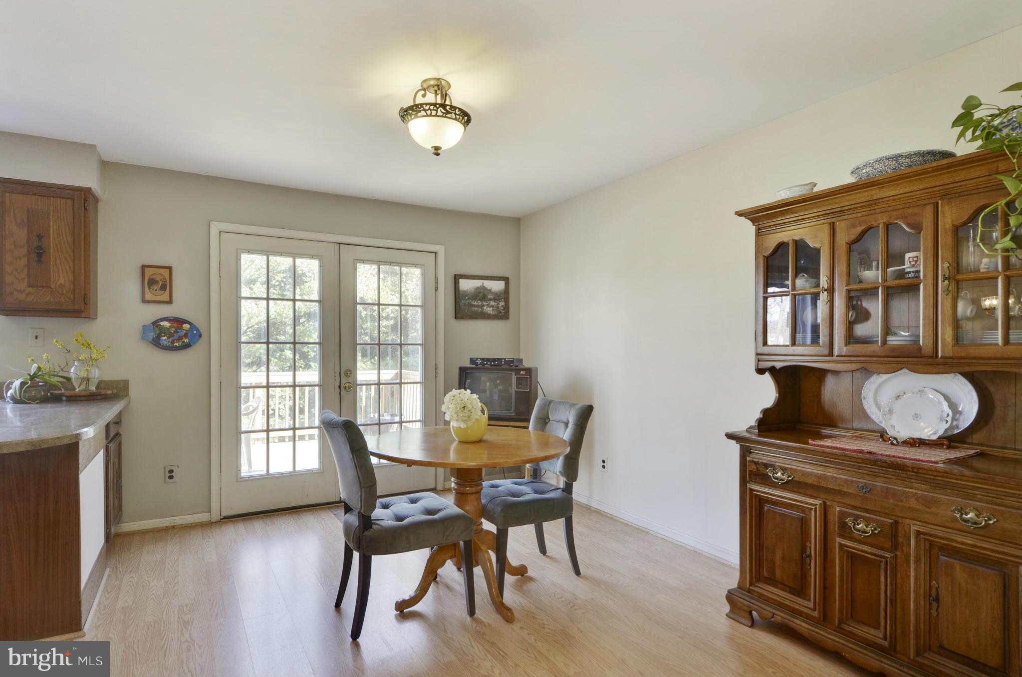 9833 Moyer Road Damascus, MD 20872 - Photo 10 of 26 a dining room with furniture and window